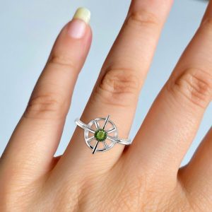 Step into a world of mysticism and wonder with our exceptional collection of moldavite rings. Each r